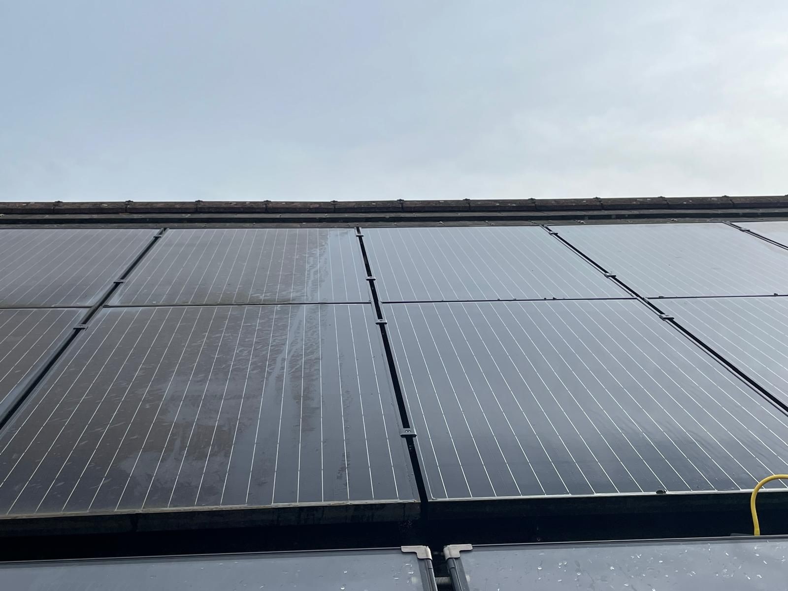 Before and after of solar panel cleaning, showing clear difference