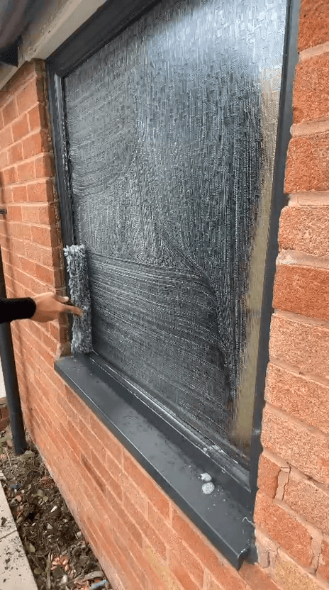 Window with detergent applied ready for cleaning, from Ex-Clean