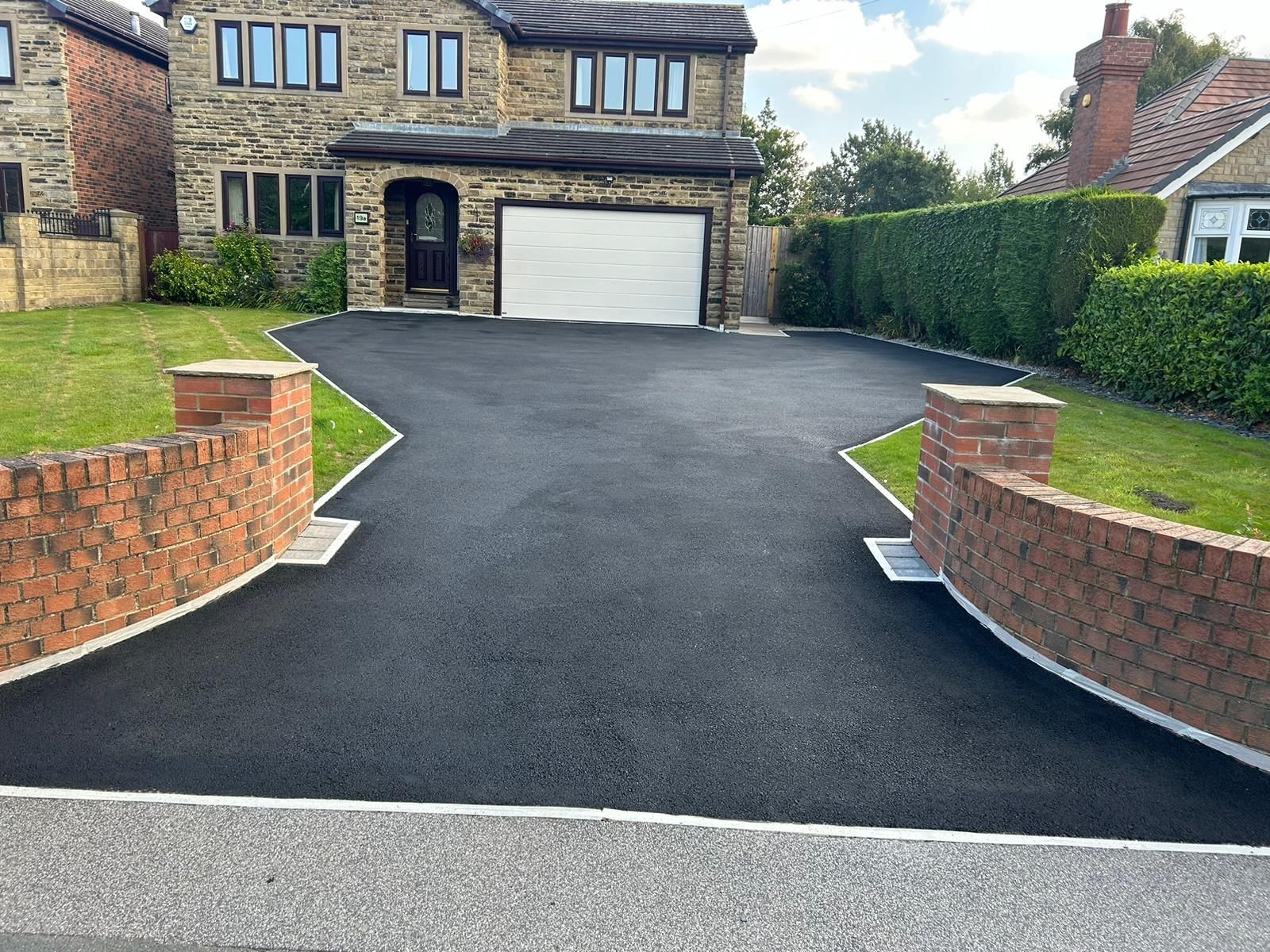 Tarmac driveway after cleaning and sealing giving a long lasting protection