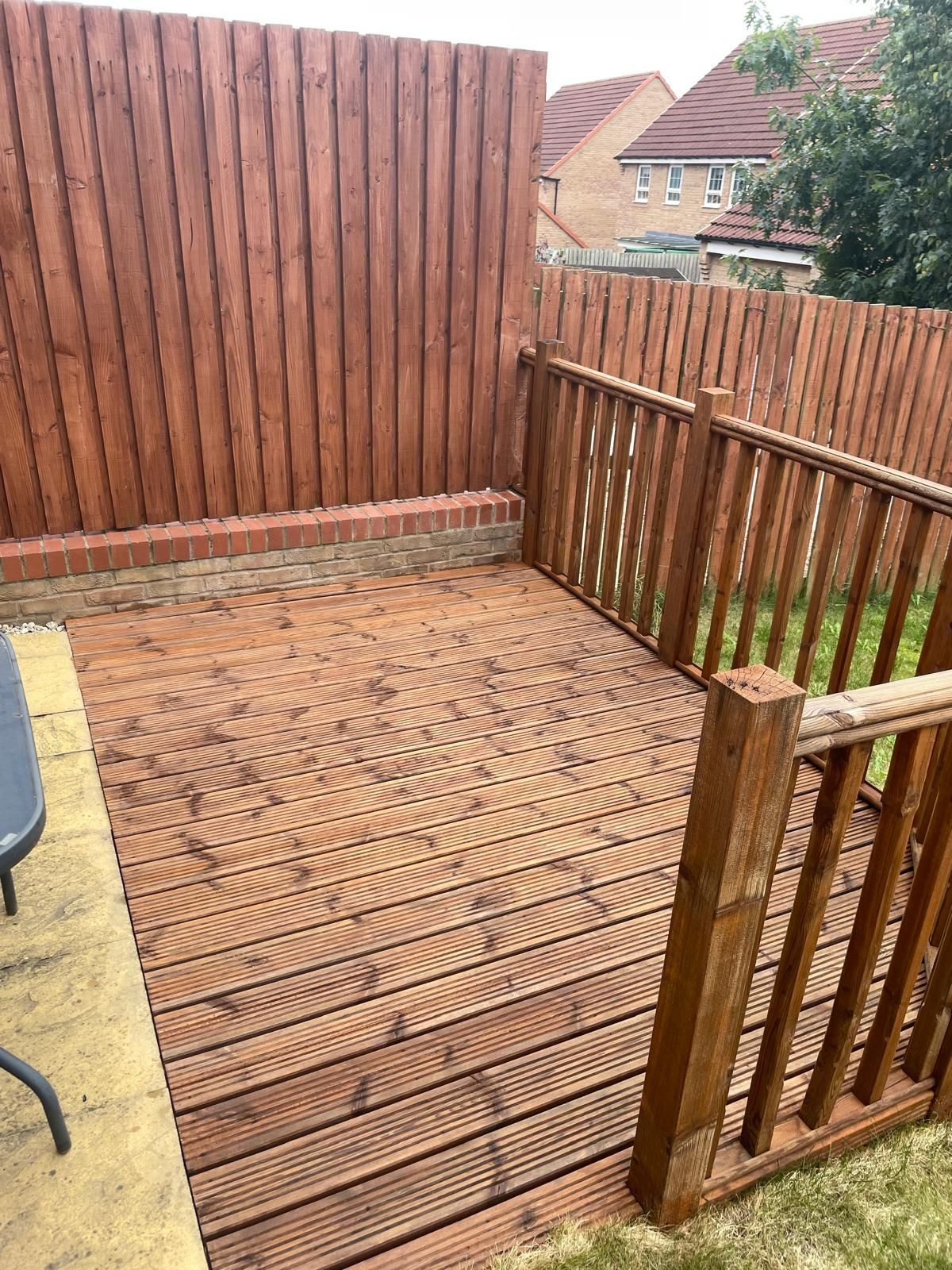 Timber decking cleaned, sanded, and sealed, with the natural wood grains now visible and the surface restored to a smooth, refreshed finish.