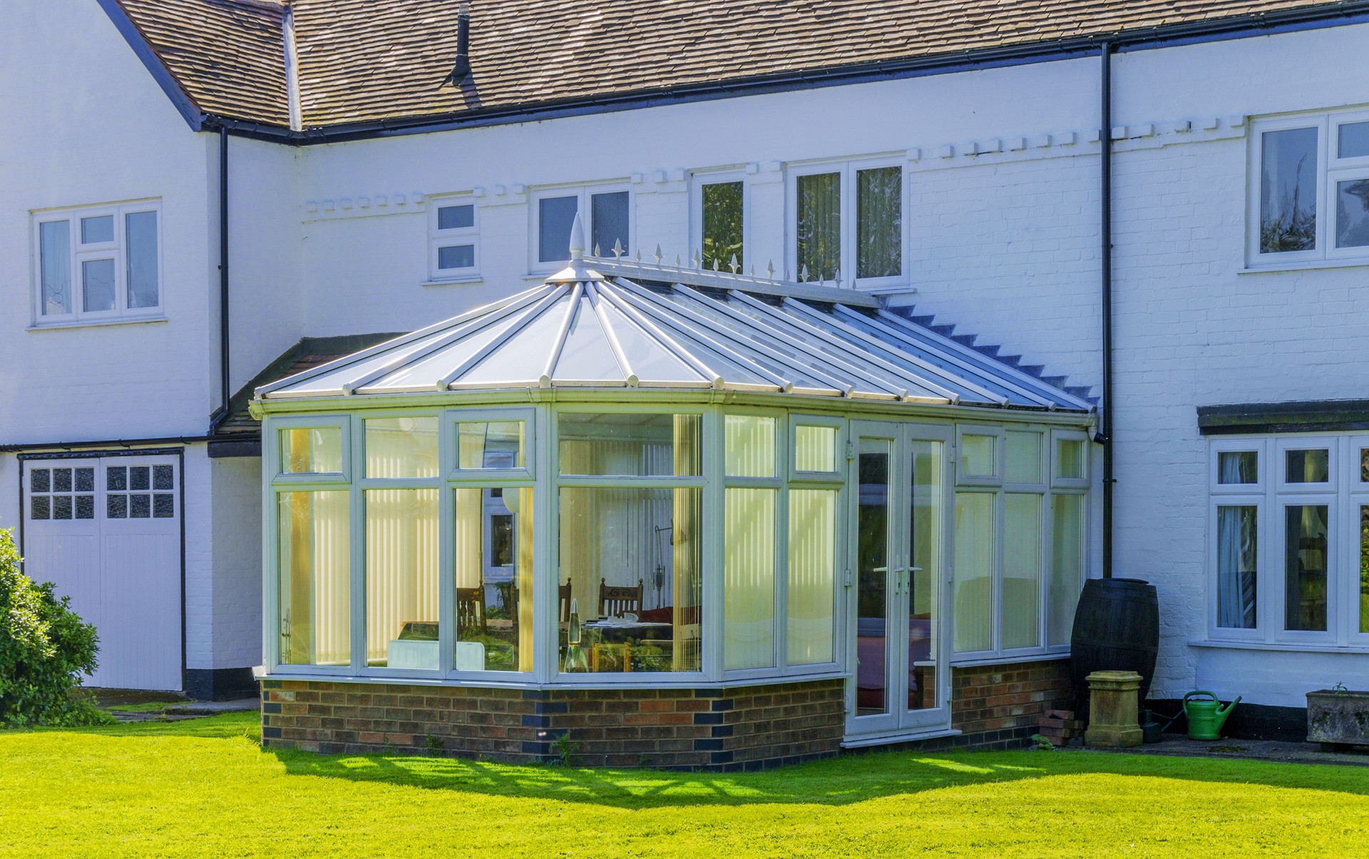 Cleaned UPVC conservatory with pristine windows and frames, looking fresh and bright.