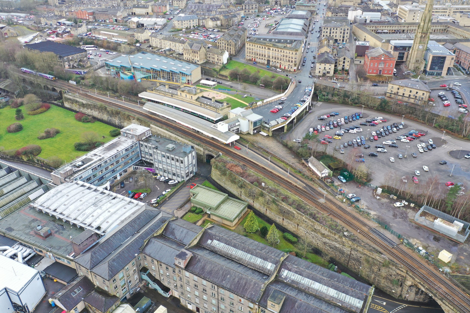 Aerial drone photo of Halifax town centre of the town of Halifax in West Yorkshire showing the old historic buildings and train station