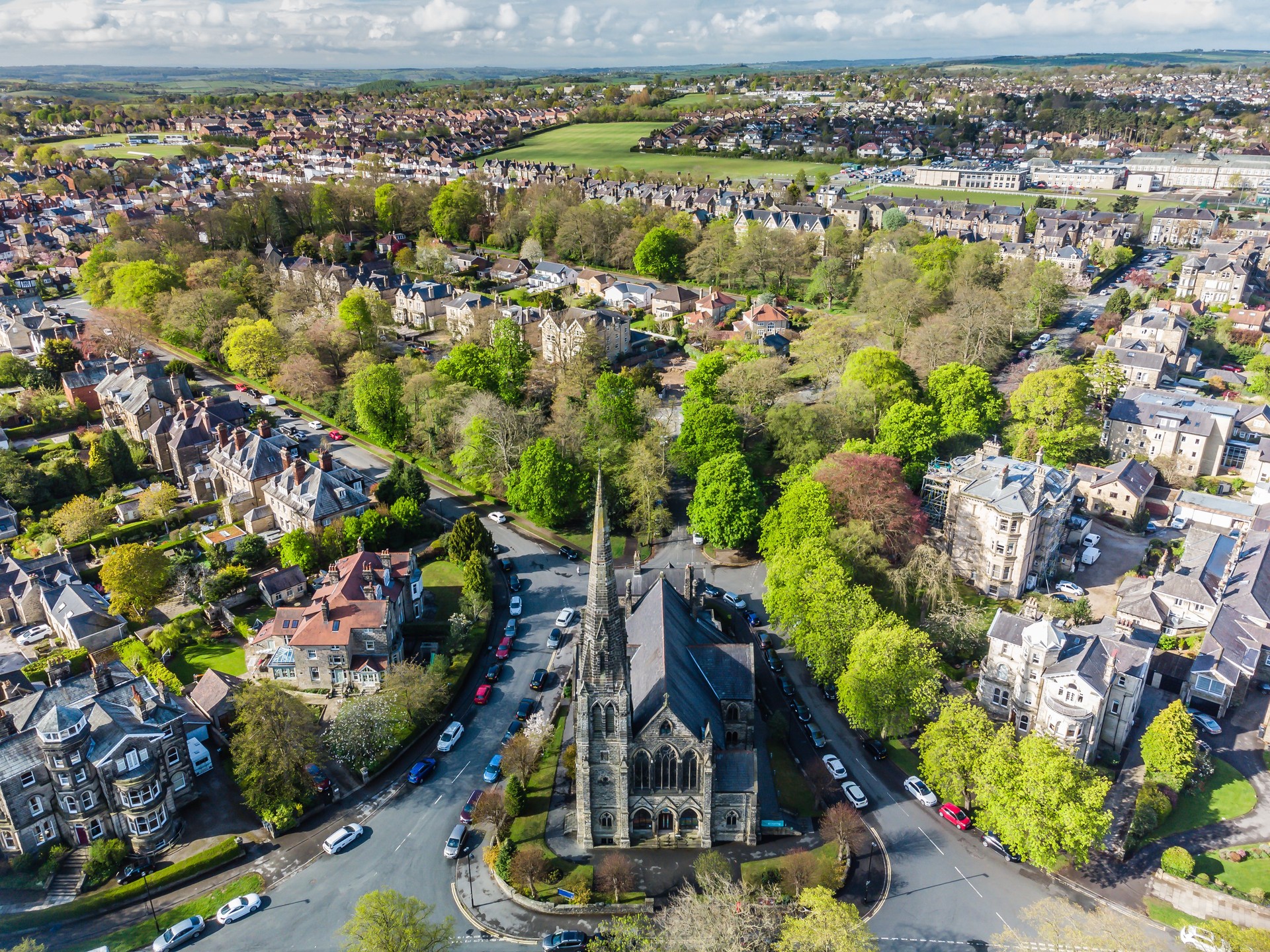 Aerial view of a church building and residential housing in the city centre of Harrogate, North Yorkshire. 
